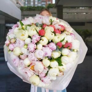 Large bouquet of coloured peonies